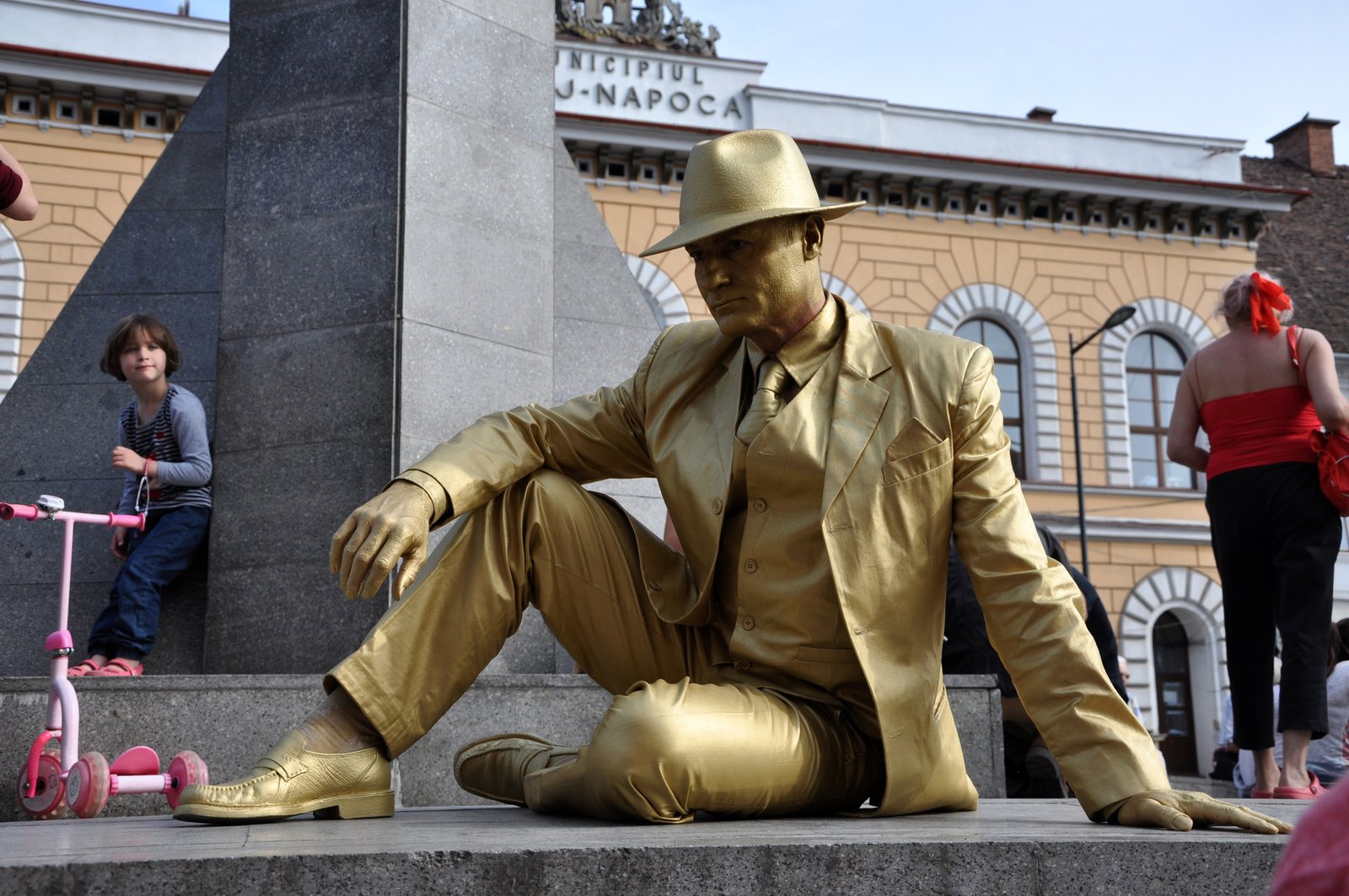 CLUJ NAPOCA - MAY 24: Living statue performer in golden costume doing a busking mime, inside the Man.In.Fest during the Cluj Days of Cluj. On May 24, 2015 in in Cluj, Romania