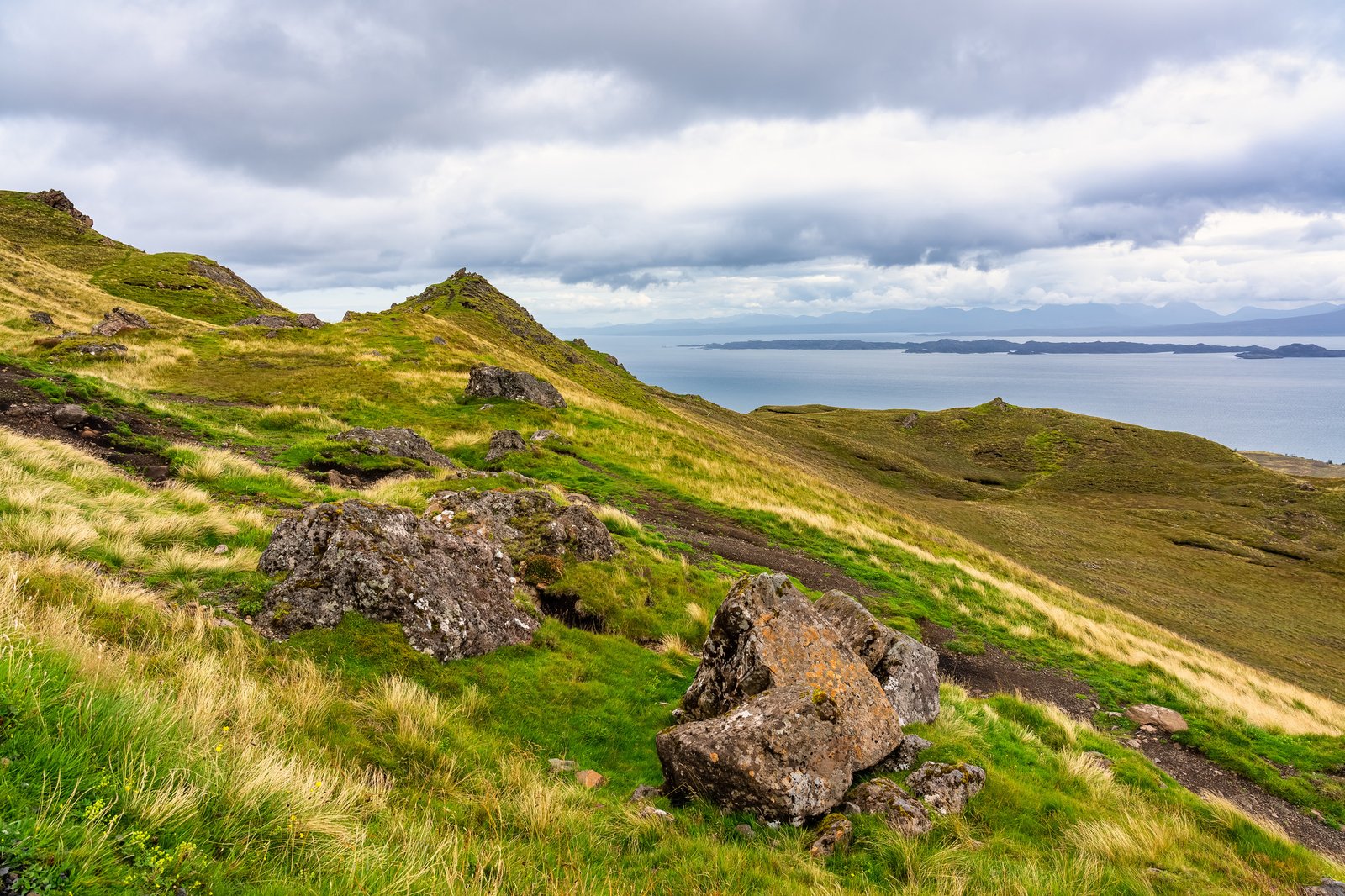 Idyllic landscape of the Isle of Skye with its mountains, grassy meadows and numerous lakes, Scotland