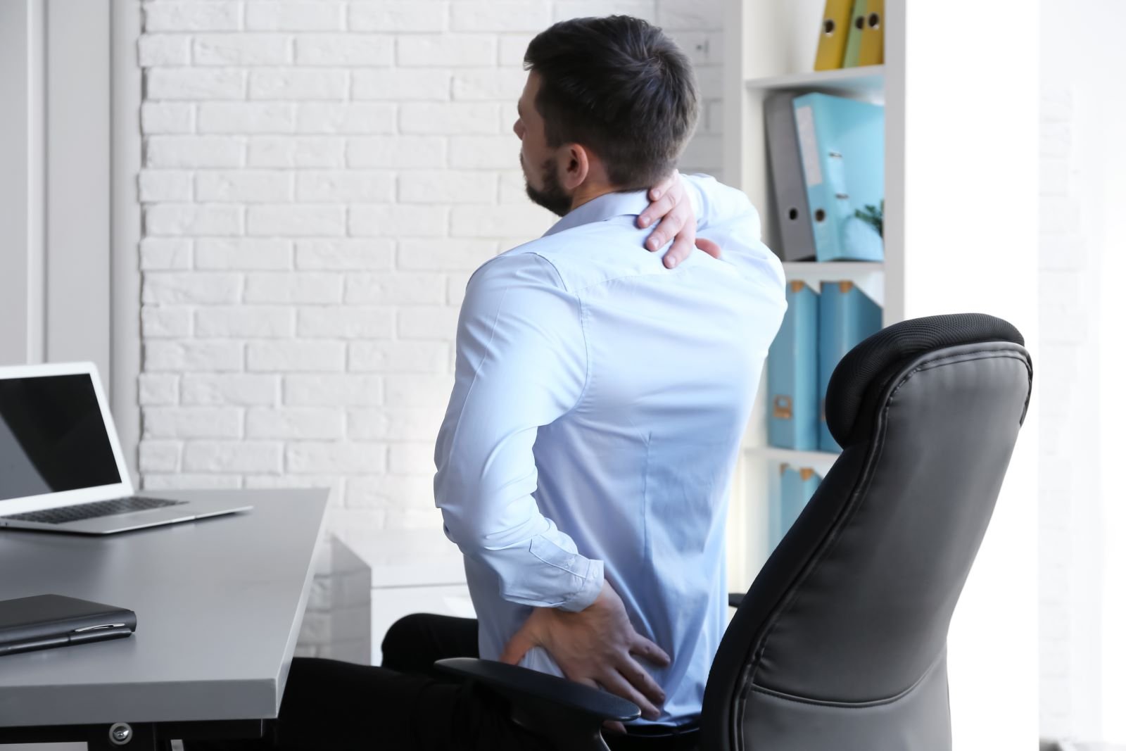 Man having back ache, poor posture