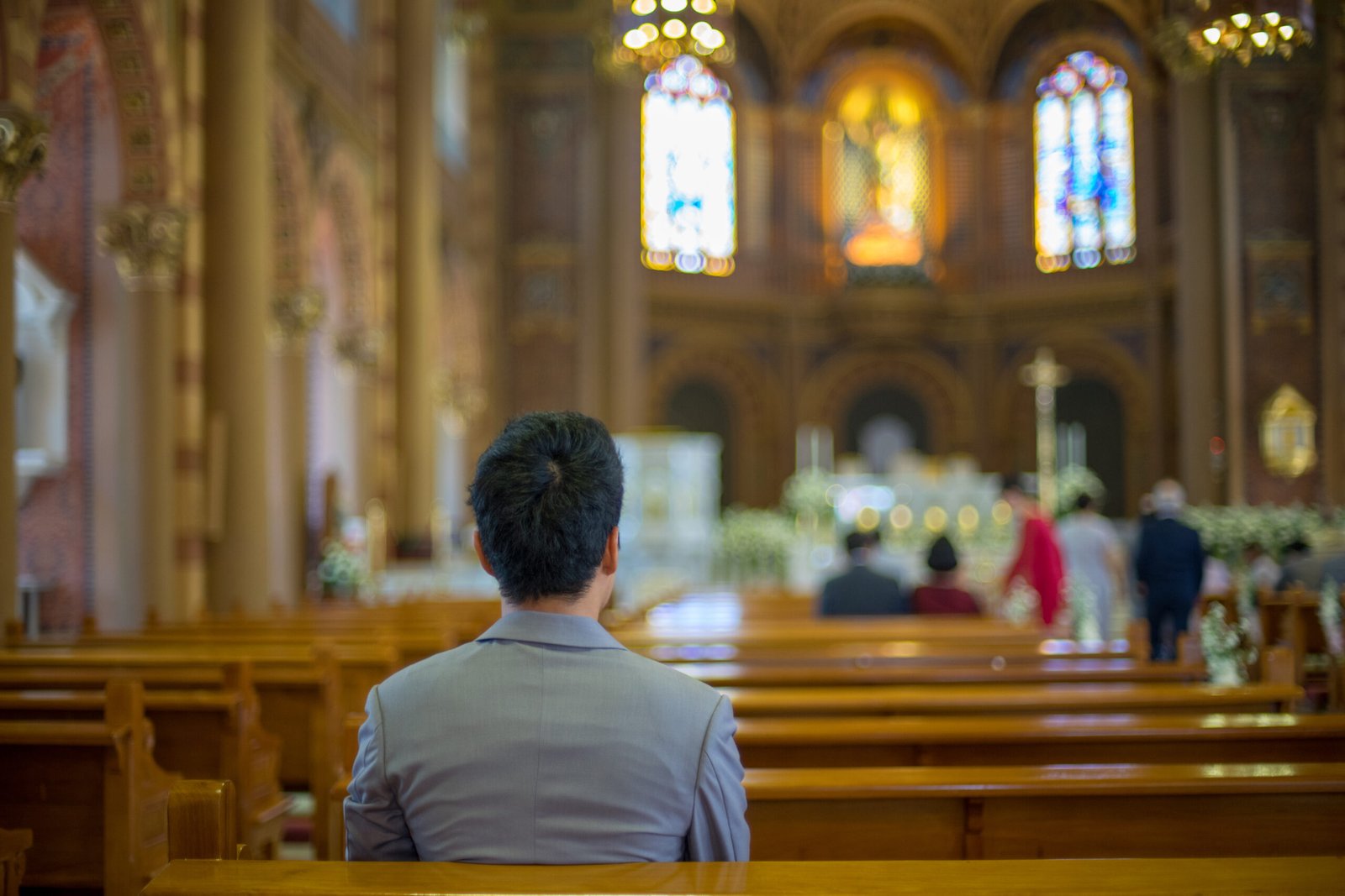 Asian,Man,Praying,In,Church