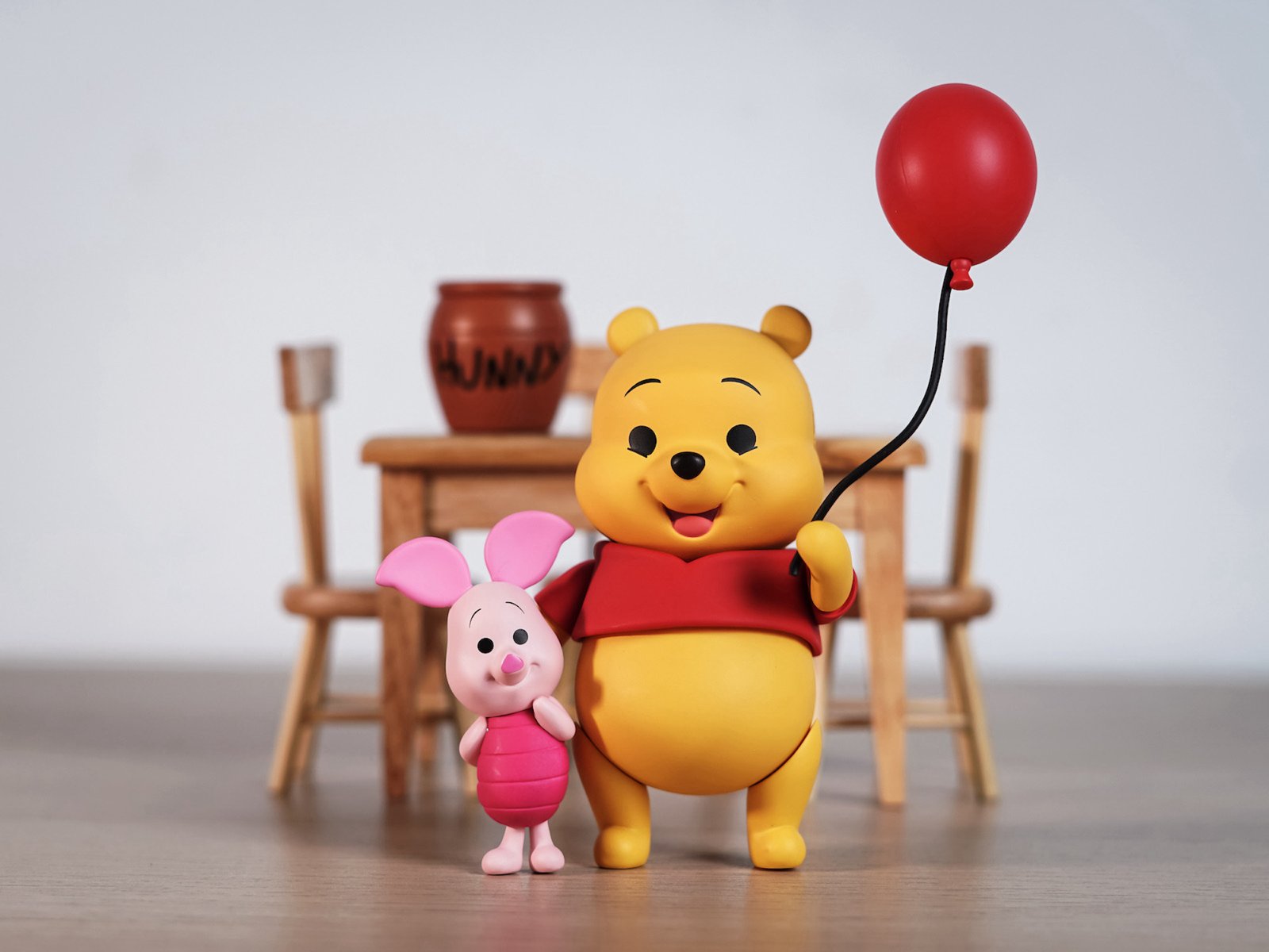 New York, USA - March 30, 2020: Winnie the Pooh and Piglet come out to greet everyone.